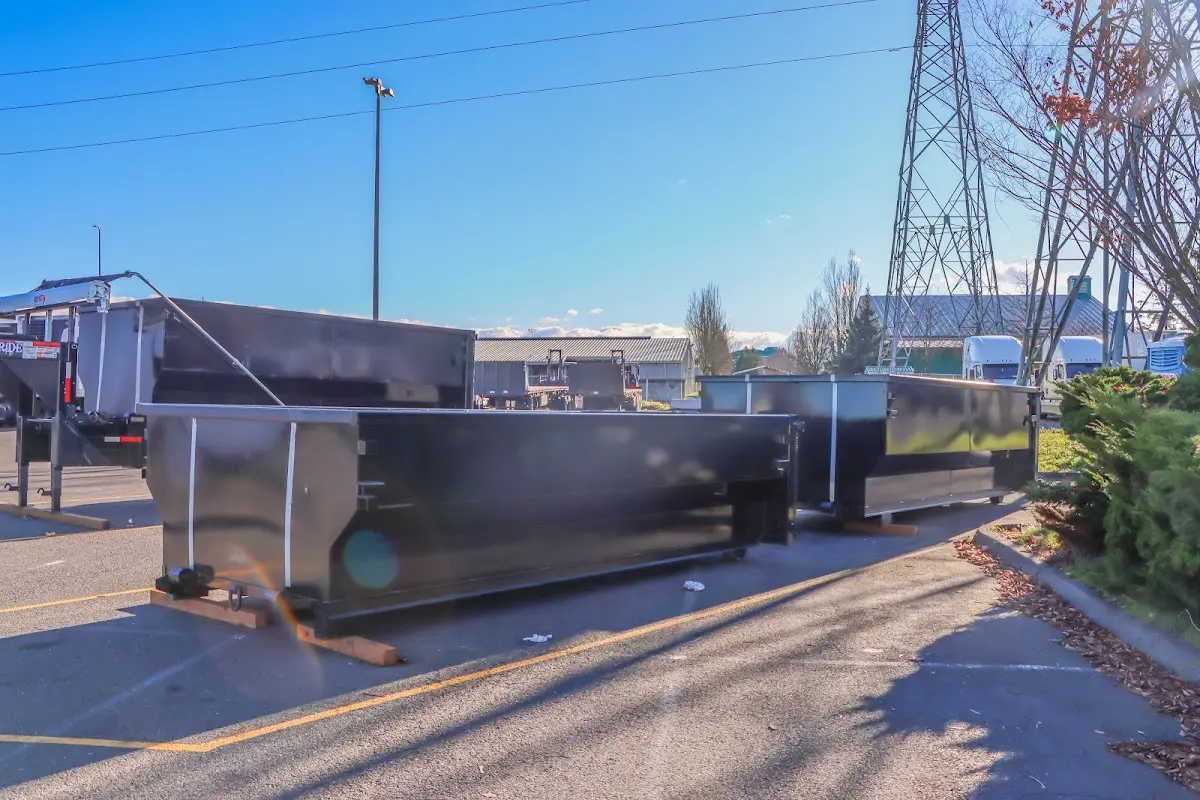 Roll-off dumpster ready for waste disposal at job site for Concrete Dumpster Rental in Porters Neck